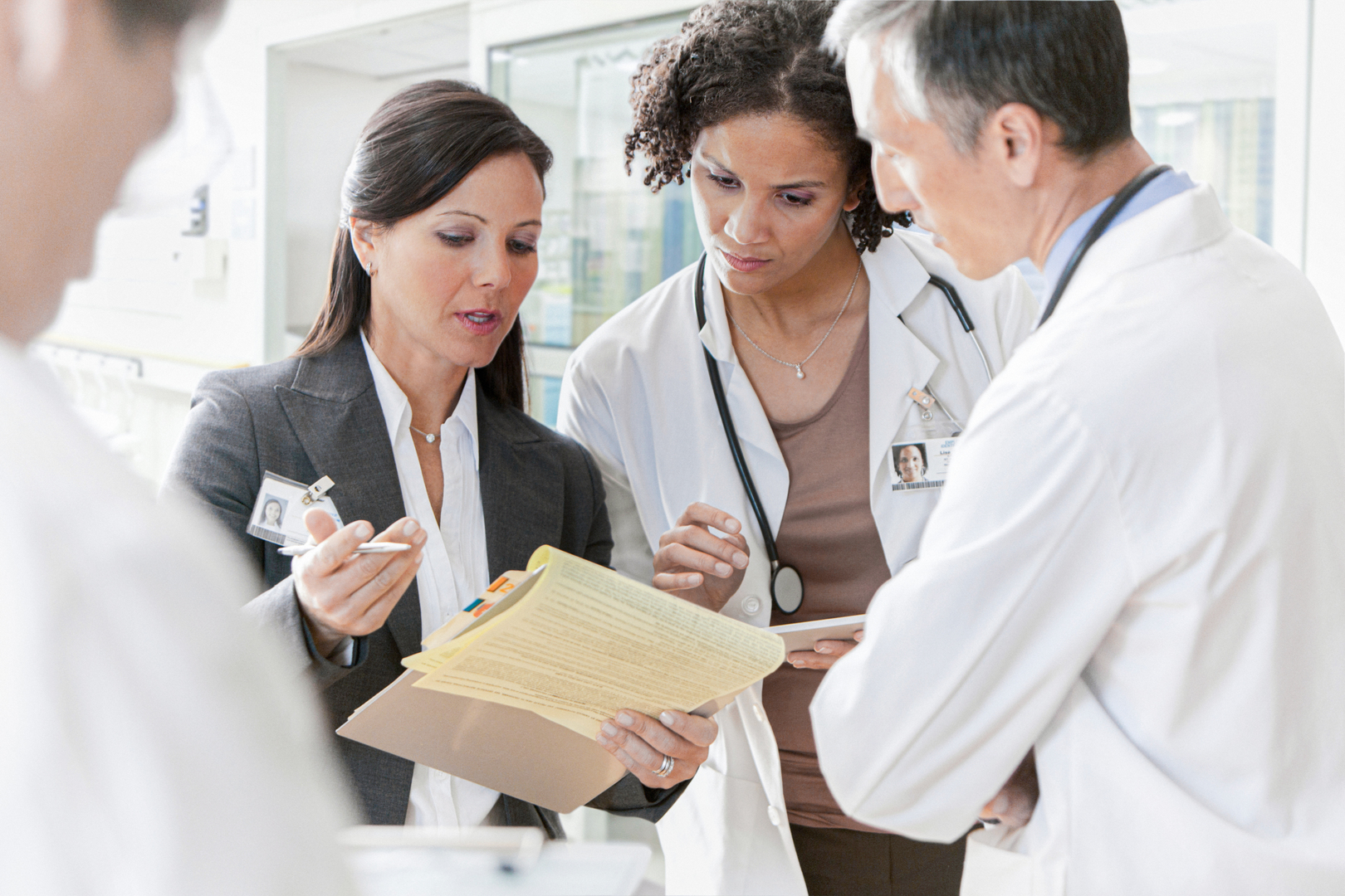 Hospital staff discussing patient charts